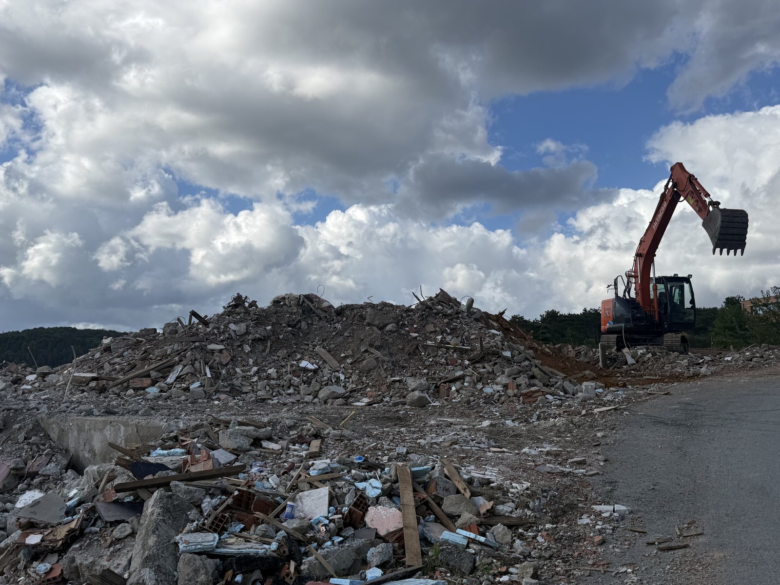 An excavator at work during demolition. October 2026